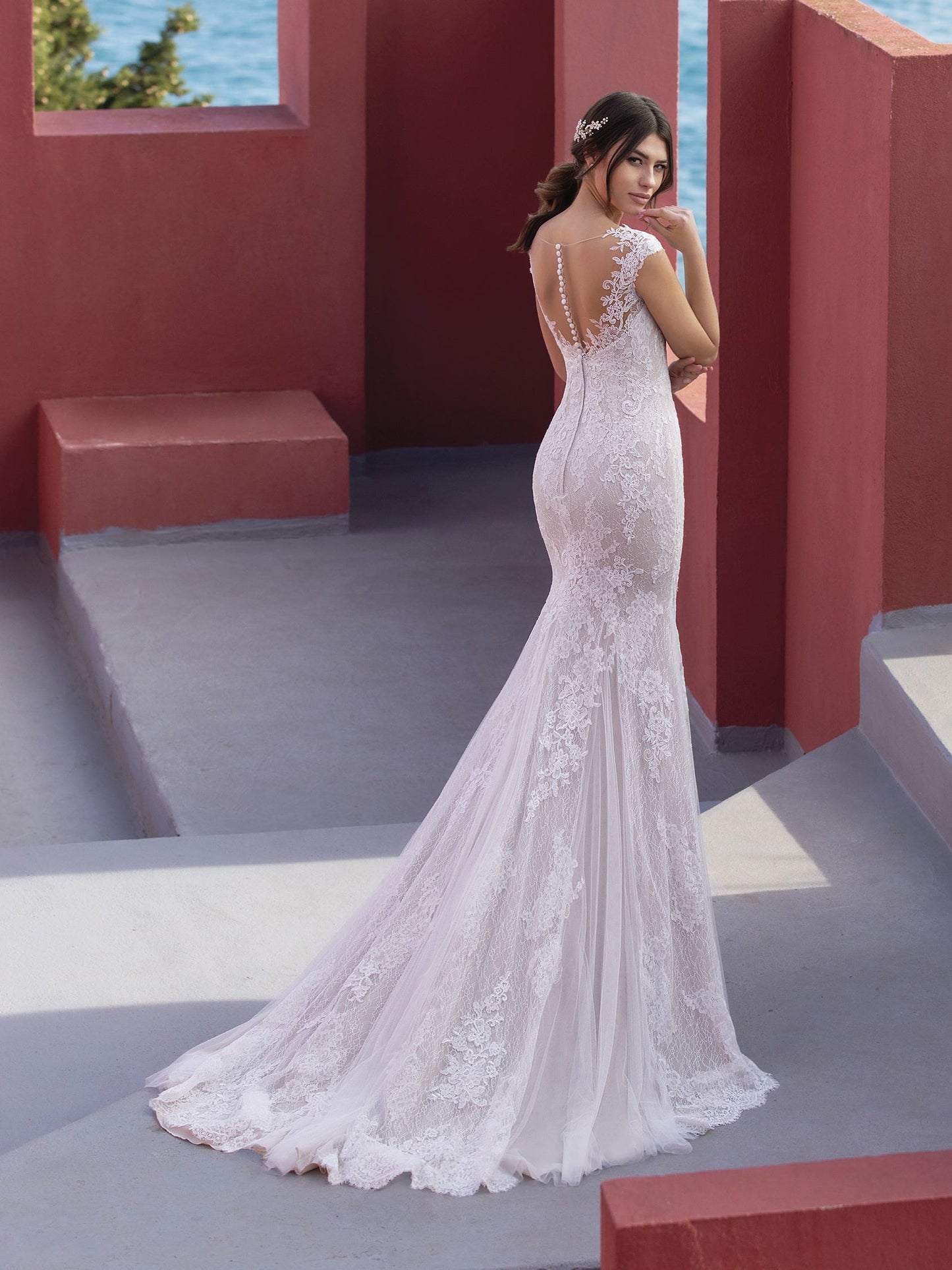 Pronovias White One Bridal CICELY  Gorgeous embroidered tulle lends a romantic, heirloom look to this sensual mermaid dress that flatters curves in all the right places. With a sexy illusion back and chapel train with a scalloped edge.  Silhouette / Cut Mermaid Neckline V-neck