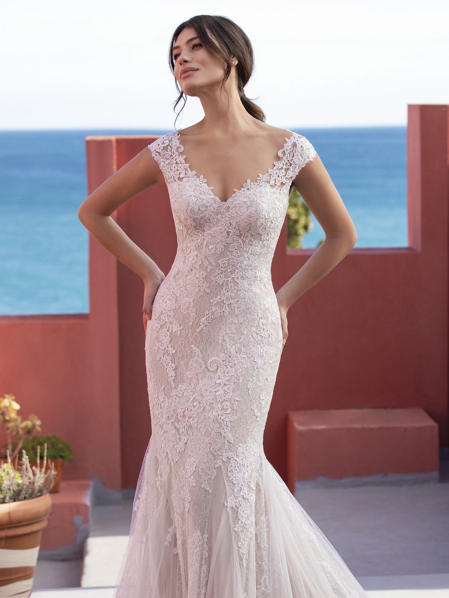 Pronovias White One Bridal CICELY  Gorgeous embroidered tulle lends a romantic, heirloom look to this sensual mermaid dress that flatters curves in all the right places. With a sexy illusion back and chapel train with a scalloped edge.  Silhouette / Cut Mermaid Neckline V-neck