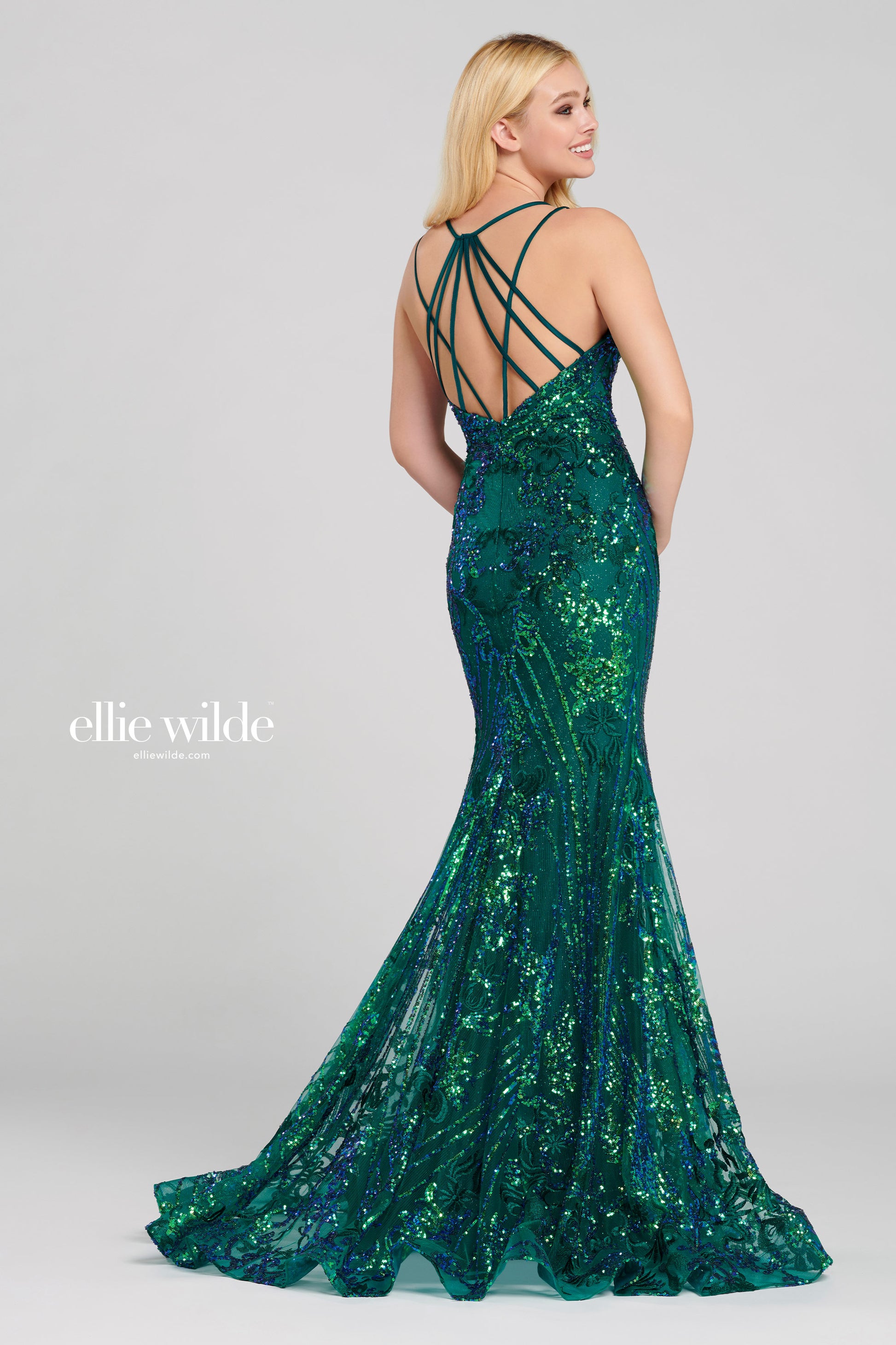 Ellie Wilde EW120028 - EW 120028 Sleeveless sequin lace fit and flare gown with a plunging V-neck, natural waist, criss cross back, horsehair hem and a sweep train. Glittering V-neckline evening gown by Ellie Wilde