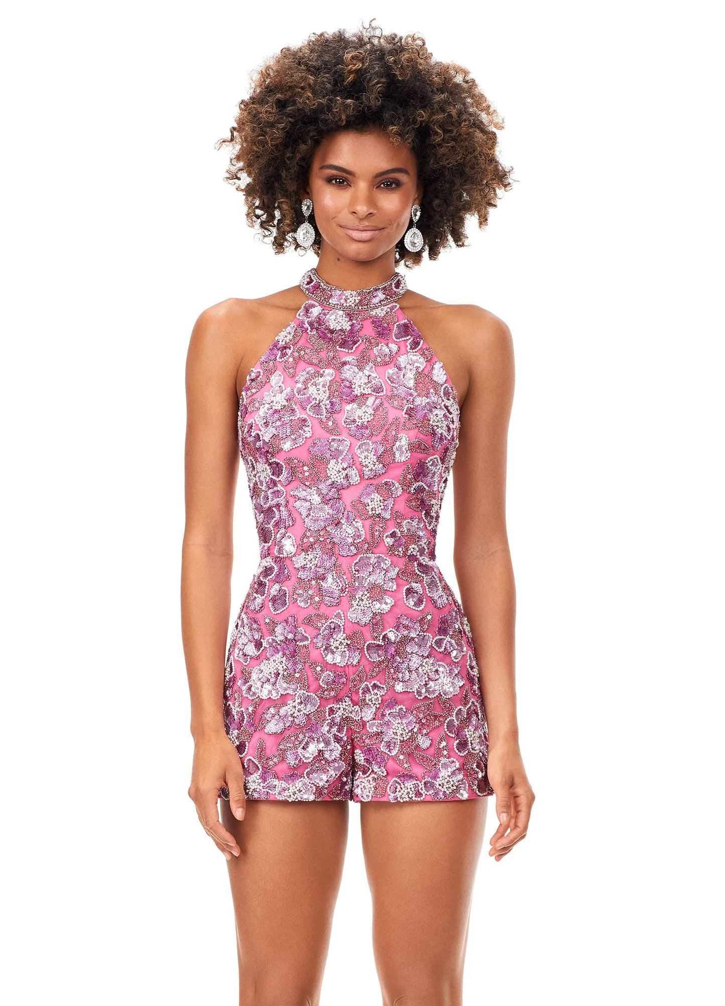 Ashley Lauren 11354 This halter romper features an intricately beaded floral motif throughout. The look is complete with a chiffon detachable skirt and beaded belt. Halter Neckline Romper Detachable Chiffon Overskirt Fully Hand Beaded COLORS: Black, Red, Ivory, Royal, Orchid/Pink