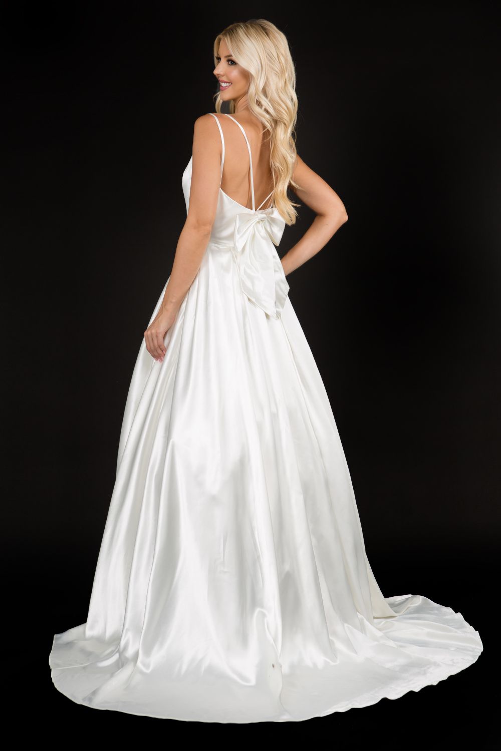 Nina Canacci 6549 Satin bow in back long A line wedding dress bridal gown with plunging v neckline and spaghetti straps Color; Ivory  Sizes  8, 10, 12, 14, 16, 18, 20, 22, 24