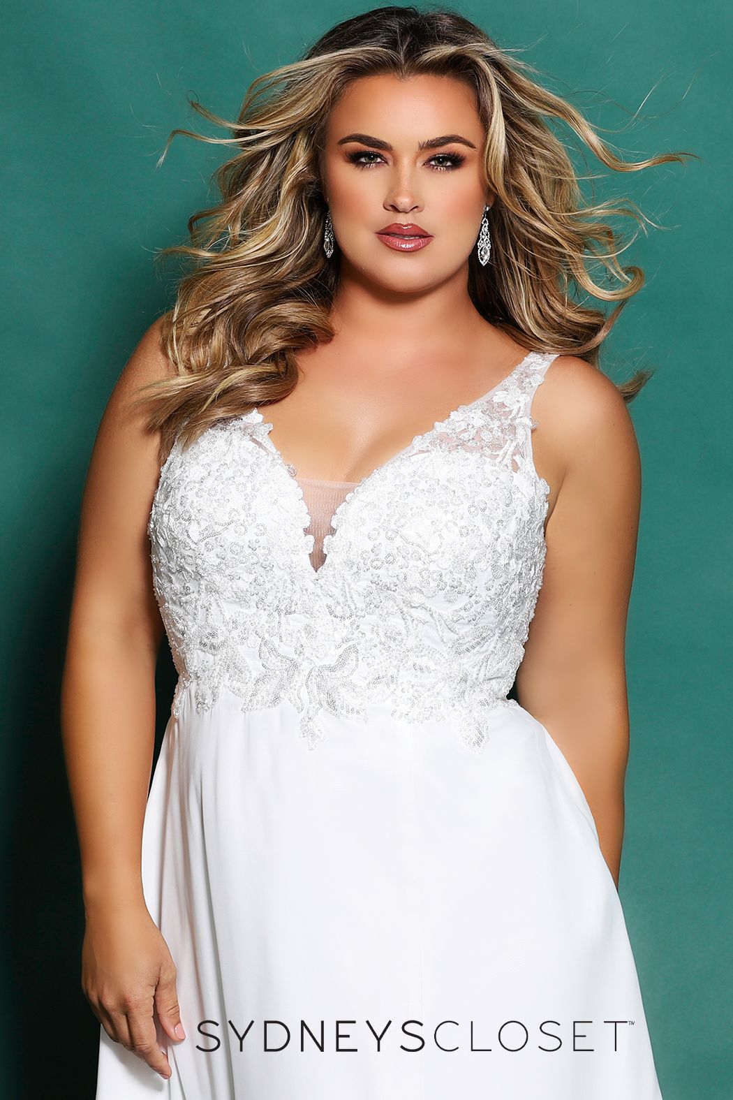 Sydney's Closet SC 5246  Float in chiffon with every step on the day of your dreams! The v-neckline bodice is adorned with floral embroidery, sequins & beading. Add a hint to the sultry factor with a mesh back along the center-back zipper, optional lining included, and the a line silhouette slit starting 15 inches below the natural waistline. Final additions of bra-friendly straps and the ever so popular pockets. SC5246