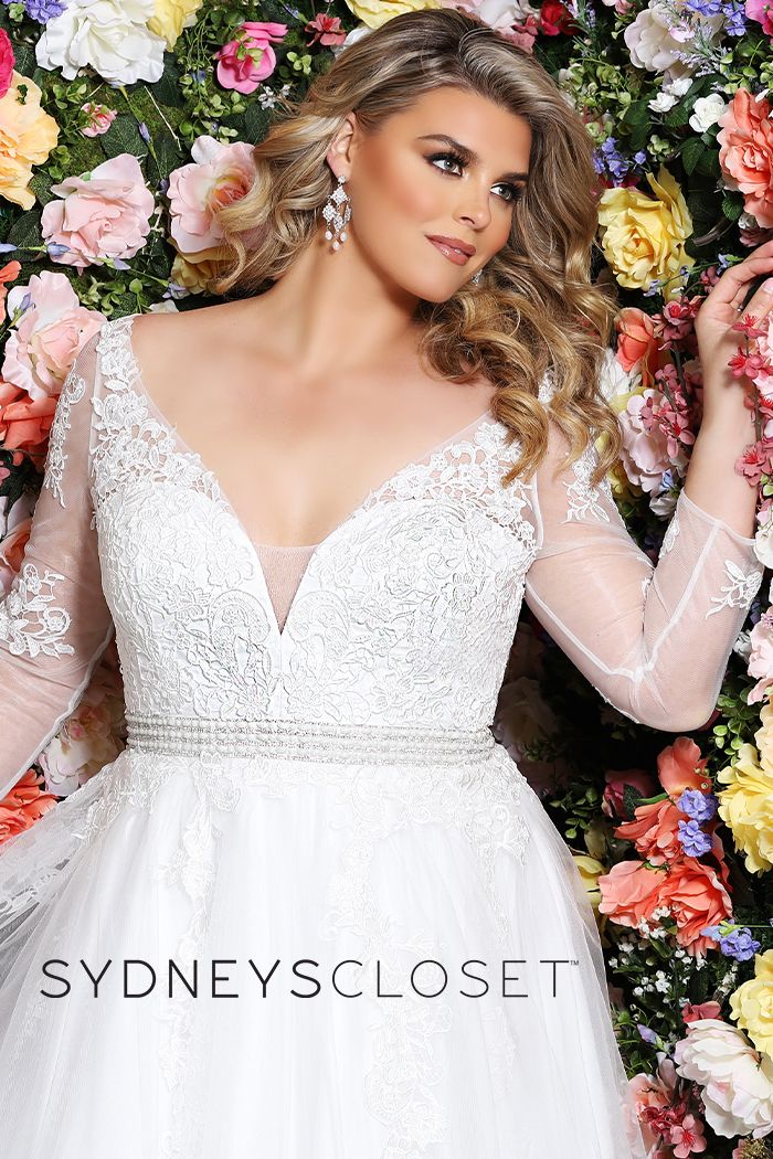 Sydney's Closet SC 5234 Cheryl Lynn Be a beautiful plus size bride in a floral lace embroidered informal wedding dress in simple, modern A-line design. Magnificent hand beaded belt accentuates your curves. Deep V-neck adds a modern design element. Lace appliques with clear sequins create just a hint of sparkle in the bodice, sleeves and tulle skirt. Designer Sydney's Closet Style SC5234 for full figure brides sizes 14 to 40.