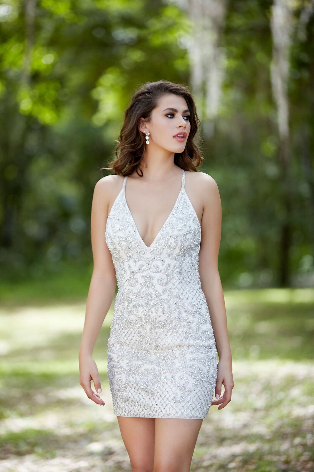 Primavera Couture 3138 plunging v neckline beaded fitted sequins short homecoming dress cocktail dress with open back and criss cross straps. Ivory short prom reception dress. 