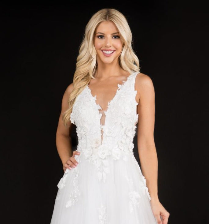 Nina Canacci 1495 is a long 3d Floral Applique embellished Deep V Neck Prom Dress. This Romantic formal gown features embellished floral appliques cascading into the tulle A Line Ballgown Skirt. Great Formal dress.  Available Sizes: 0-10  Available Colors: Ice Blue, Ivory