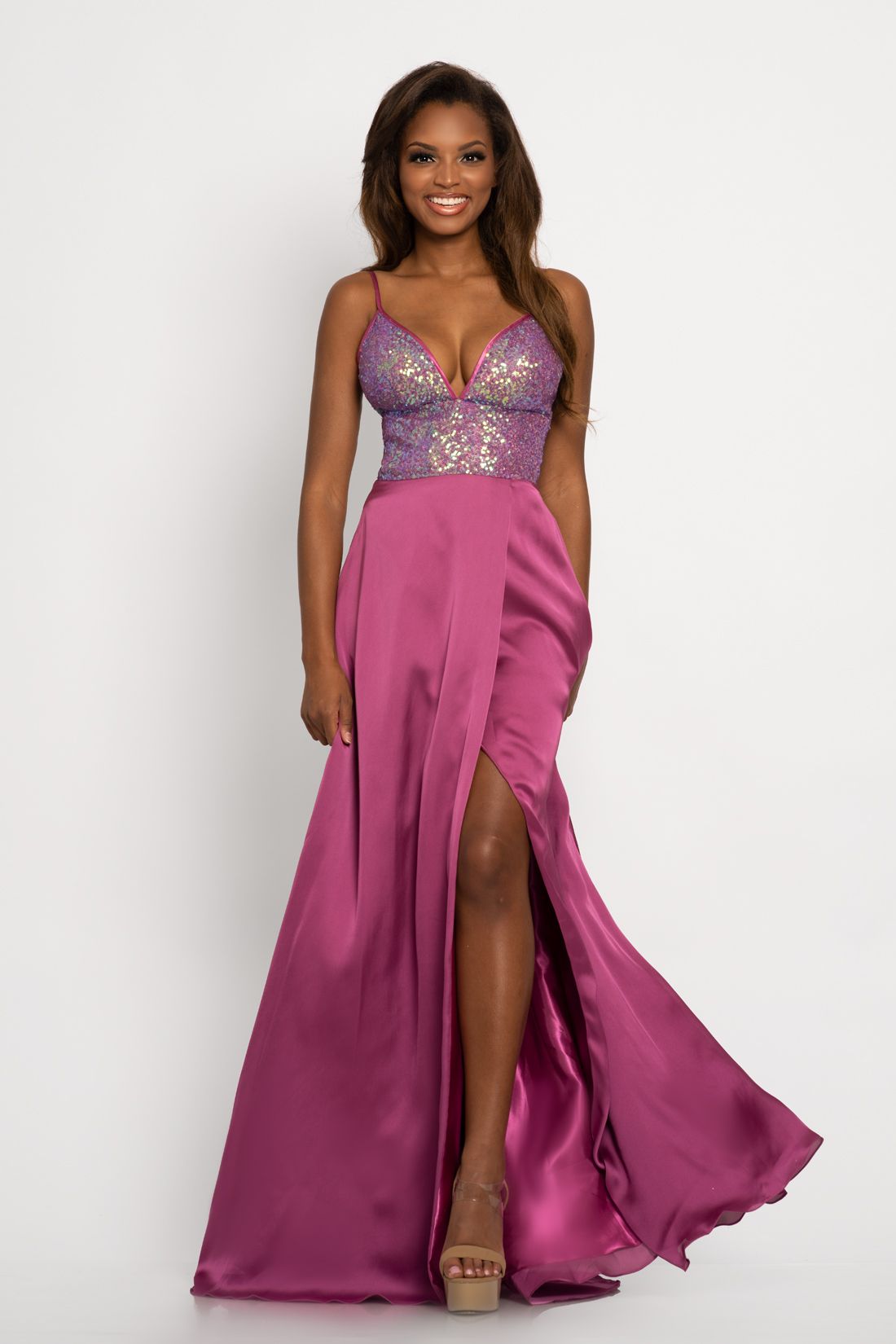 Johnathan Kayne 2214 Sequin bodice with a V neckline trimmed with charmeuse and spaghetti straps A line prom dress. The long charmeuse skirt on this pageant dress features a wrap style slit.   Colors Berry, Navy, Teal  Sizes  00, 0, 2, 4, 6, 8, 10, 12, 14, 16 